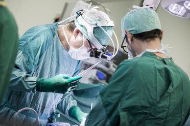 Heart surgeons and operating room nurse during a heart valve operation - MWEF000061