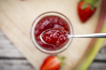 Glass of homemade strawberry rhubarb jam - LVF004902