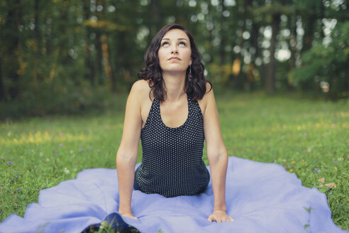 Croatia, Woman practicing yoga in the woods, yoga in nature - LCU000003