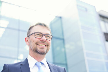 Portrait of smiling businessman outdoors - MAEF011793