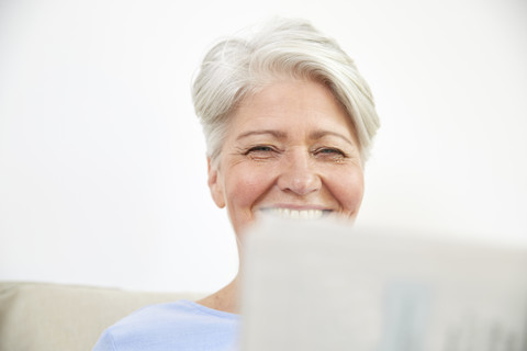 Portrait of smiling woman with laptop stock photo