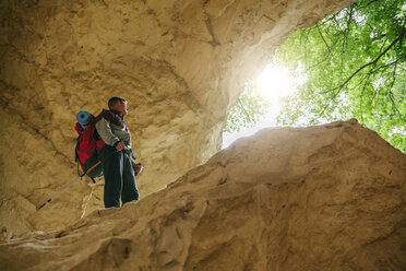 Serbia, Rakovac, young man hiking, cave, abandoned quarry - ZEDF000175