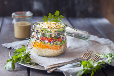 Rainbow salad in a jar, quinoa, carrots, peas, red cabbage, bell pepper, mung bean sprouts, dressing aside - SBDF002920