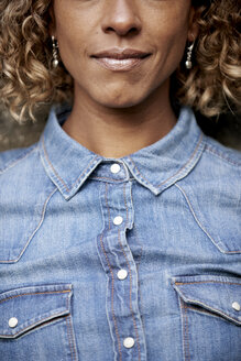 Woman wearing denim shirt, partial view - JCF000026