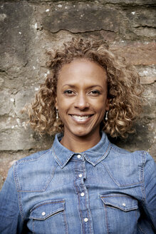 Portrait of smiling woman wearing denim shirt - JCF000027