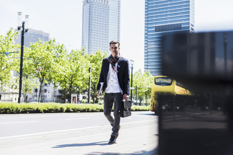 Young man on the move in the city stock photo