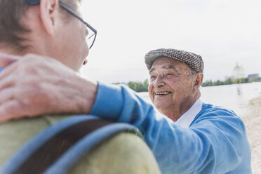 Portrait of smiling senior man with his grandson - UUF007635