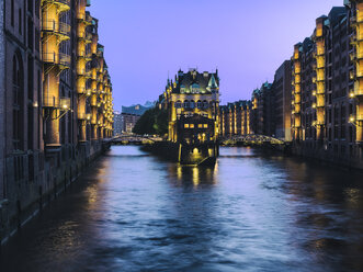 Germany, Hamburg, view to lighted Old Warehouse District at blue hour - KRPF001762