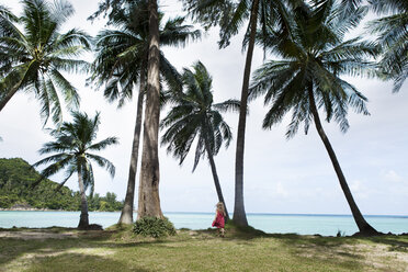 Thailand, girl on palm beach - SBOF000019