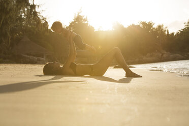 Thailand, mother and son playing on beach - SBOF000033