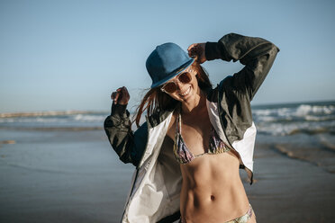 Portrait of a stylish young woman on beach - KIJF000425