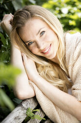 Portrait of smiling blond woman - GDF001012