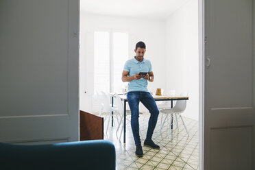 Young businessman in office using digital tablet - EBSF001515