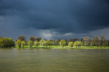 Germany, North Rhine-Westphalia, Rhine riverbank and stormy atmosphere - SKAF000015