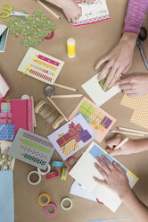 Hands making greeting cards - NHF001523