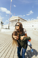 Austria, Vienna, women in front of Parliament building - AIF000332