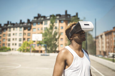 Young man using virtual reality glasses - DAPF000173