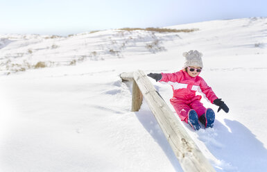 Little girl playing in a snow - MGOF001978