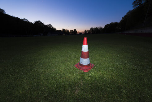 Germany, Traffic warning cone on a soccer field - SKAF000021