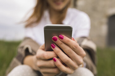 Hands of woman holding smartphone - BOYF000441