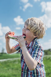 Boy outdoors eating slice of watermelon - MJF001909