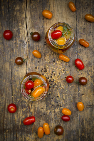 Two glasses of pickled tomatoes stock photo