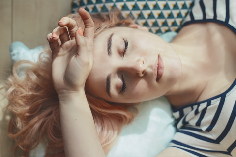 Portrait of young woman with eyes closed stock photo