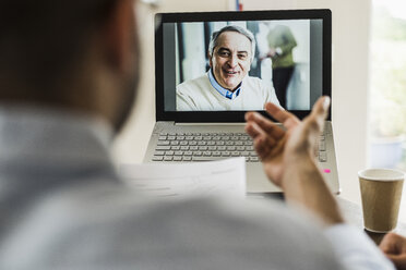 Businessman having a video conference in office - UUF007876