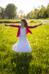 Girl with blowballs moving on a meadow - SARF002801