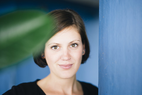 Portrait of smiling young woman with nose piercing stock photo