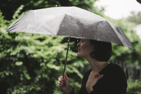 Woman with umbrella on a rainy day - DASF000049