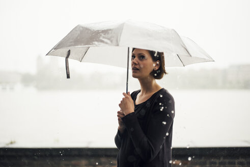 Woman with umbrella on a rainy day - DASF000052
