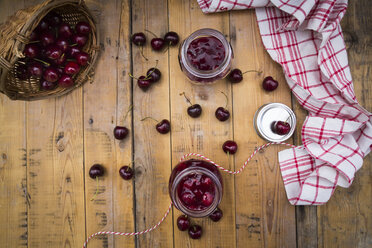 Two glasses of homemade cherry groats and cherries on wood - LVF005066