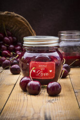 Glass of homemade cherry groats and cherries on wood - LVF005068