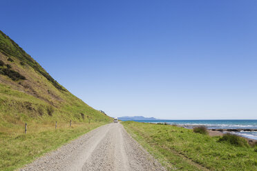 New Zealand, North Island, East Cape, only road to East Cape, camperv on gravel road - GWF004777