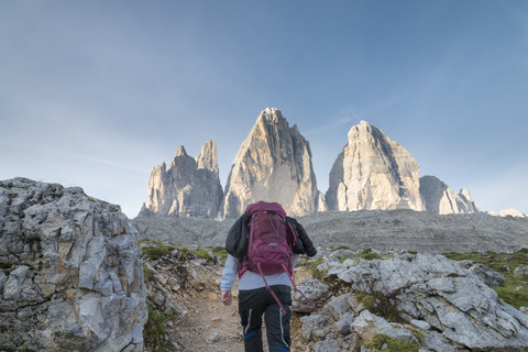Italy, Alto Adige, Dolomites, female hiker in front of Tre Cime di Lavaredo stock photo