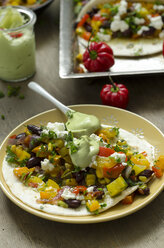 Tortilla with vegetables and feta on plate - ODF001408