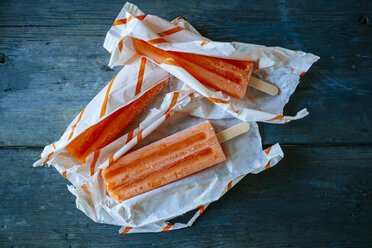 Orange snow ice cream in wrappings - KIJF000511