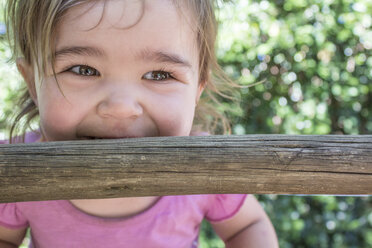 Cute little girl on rung of a ladder - ZEF009037