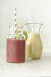 Glass bottles of different fruit smoothies - ODF001410