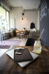 Mobile devices on table in a cafe - ONF000952