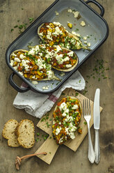 Filled aubergine with bell pepper, tomato, courgette, sheep cheese and parsley, slices of multigrain bread - ODF001412