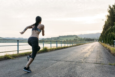 Woman running outdoors - MGOF002050