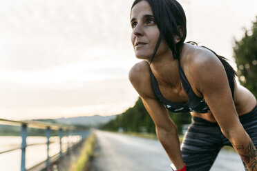 Woman taking a breather at training - MGOF002053