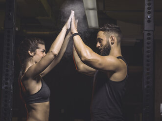 Fitness, couple in gym, high five - MADF001027