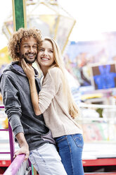 Happy couple at a funfair - GD001071