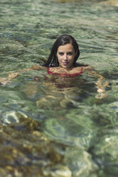 Woman in water, smiling - SKCF000109