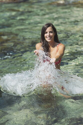 Woman splashing with water - SKCF000113