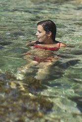 Woman in water, smiling - SKCF000114