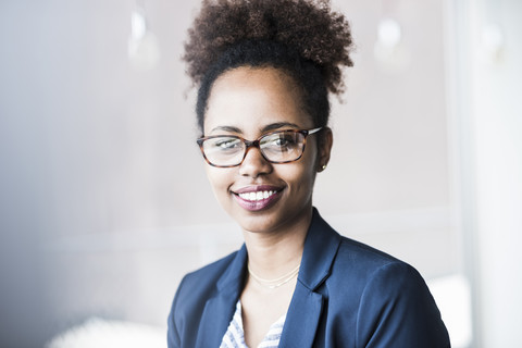 Portrait of smiling businesswoman wearing glasses stock photo